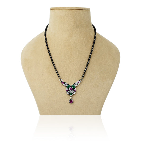 Elegant silver mangalsutra featuring a unique designer pattern with colorful gemstone accents