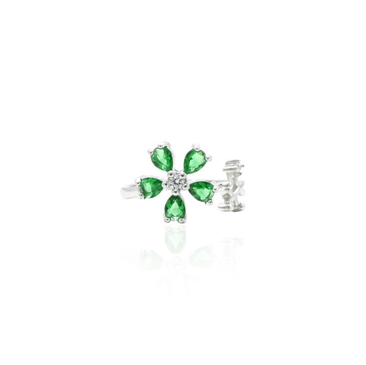 Silver ring featuring a delicate green flower-shaped gemstone, offering a charming and elegant accessory.