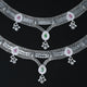 Dual-layer silver anklet featuring green and pink teardrop gemstones