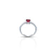 Elegant silver ring adorned with a vibrant round ruby