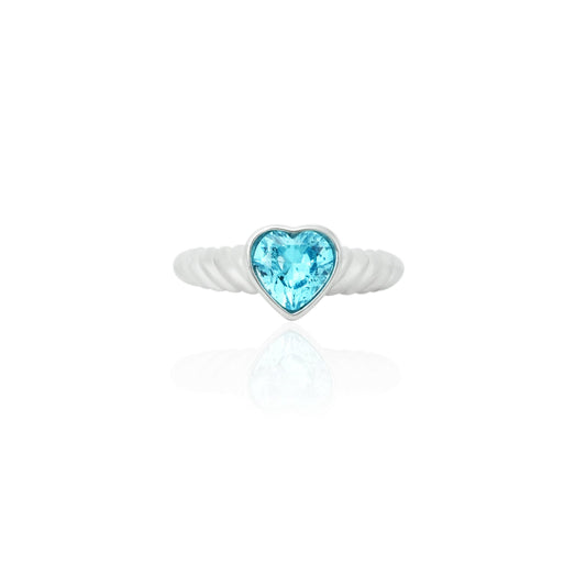 Sterling silver ring featuring a sky-blue stone in a heart-shaped design.