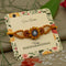 Silver Center Ganesh Ji with Wooden Theme Flower Design Rakhi for Boys