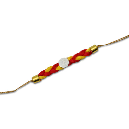 Boys' Rakhi featuring a silver Swashtika centerpiece with red and yellow tangle Moli