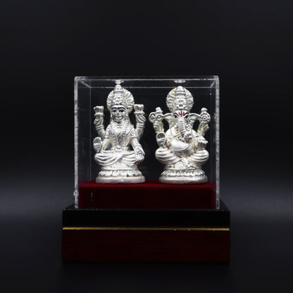 Handcrafted silver statue of Goddess Lakshmi and Lord Ganesh, symbolizing prosperity and blessings.