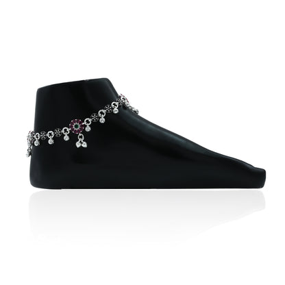 Elegant silver anklet featuring a detailed flower pattern and ghungroo bells