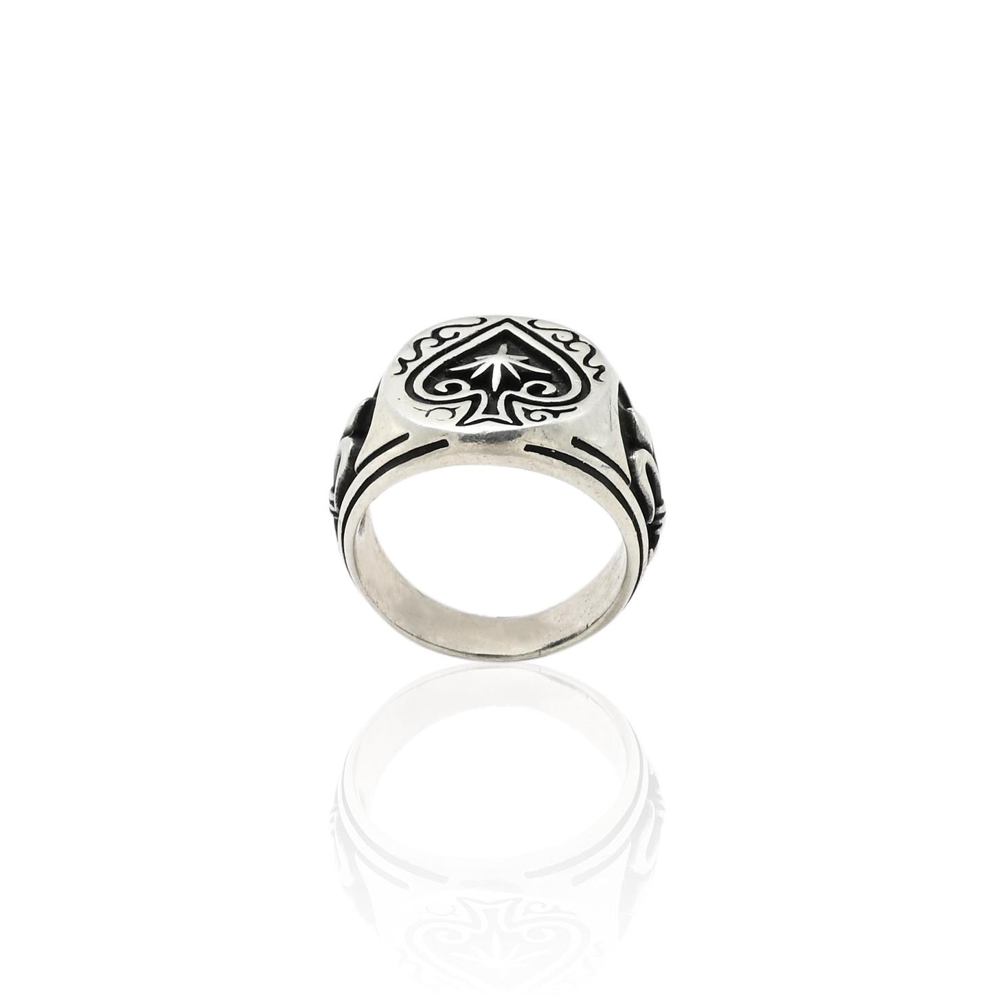 Close-up of a silver boys' ring showcasing an intricate 'hole cards' pattern for a bold look.