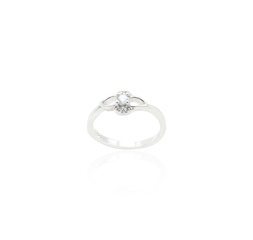 Close-up of a silver ring with a classic solitaire stone, enhanced by a unique loop design for added sophistication.