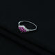 Stylish sterling silver ring with multiple pink stones, perfect accessory.