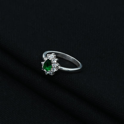 Pear-cut green stone set in a delicate silver ring, perfect for a stylish touch