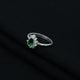 Pear-cut green stone set in a delicate silver ring, perfect for a stylish touch