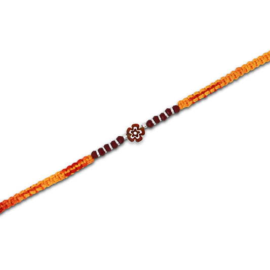 Boys' Rakhi featuring a silver brown flower centerpiece and silver, light brown beads.