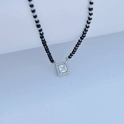 Sparkling square pendant on classic black beaded mangalsutra.