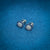 Stylish silver earrings with bold blue pearl studs