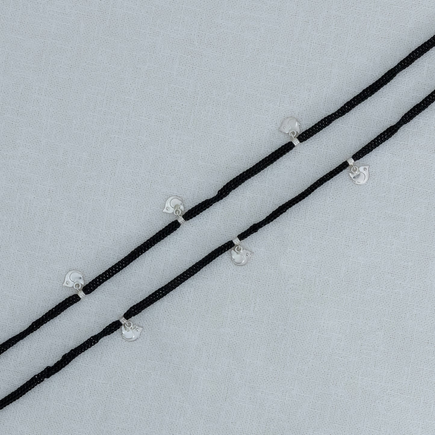 Elegant Silver Charm Thread Anklet with Black Dori & Cute Bird Drop
