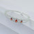 Elegant Silver Bracelet with Trio of Orange Stones for Girls.