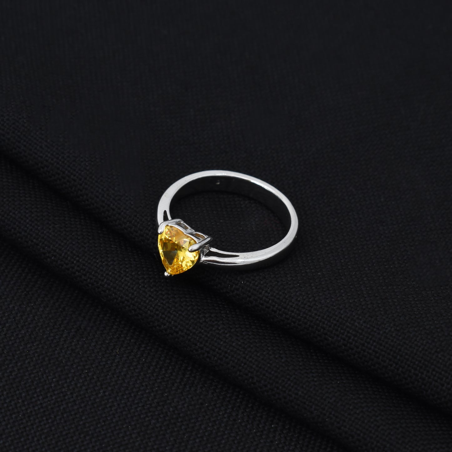 Beautiful sterling silver ring with heart-shaped yellow gem.