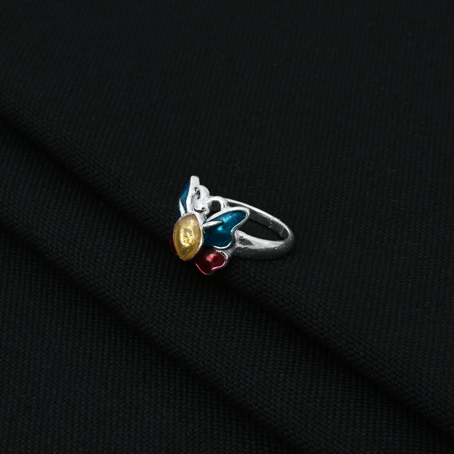 Stylish silver ring showcasing a colorful butterfly, designed for a cute and whimsical baby accessory.