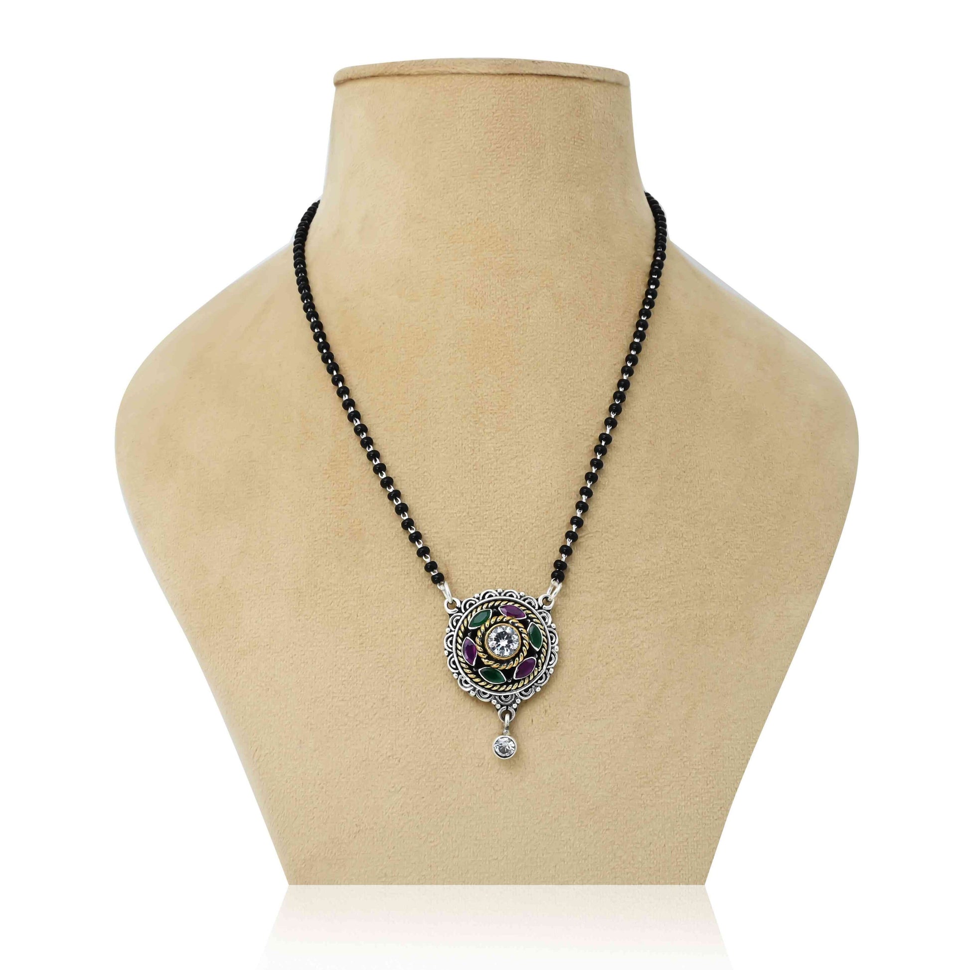 Sterling silver mangalsutra featuring a maroon gemstone and intricate flower design