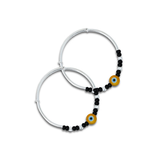 Baby silver kada payal featuring a yellow evil eye with black and silver beads.