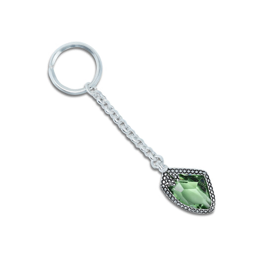 Stylish silver chain keychain featuring a vibrant green gemstone for a chic accessory