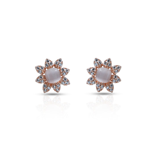 Silver stud earrings with a floral design and a pearl center