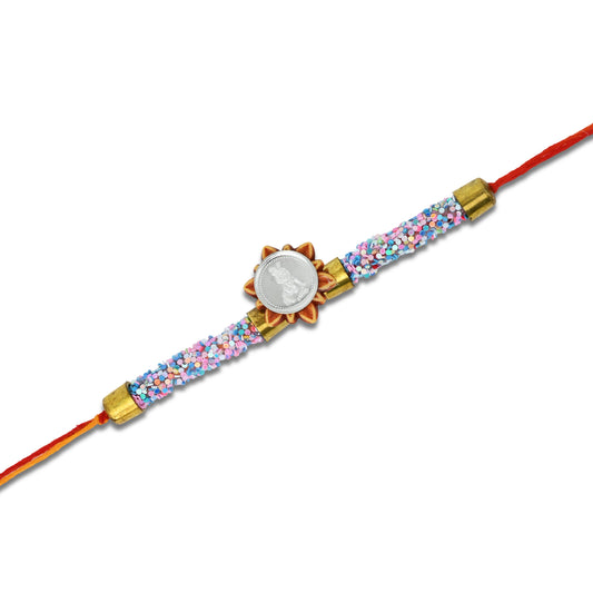 Boys' Rakhi featuring a silver Baal Gopal design and pink-blue flat circular beads