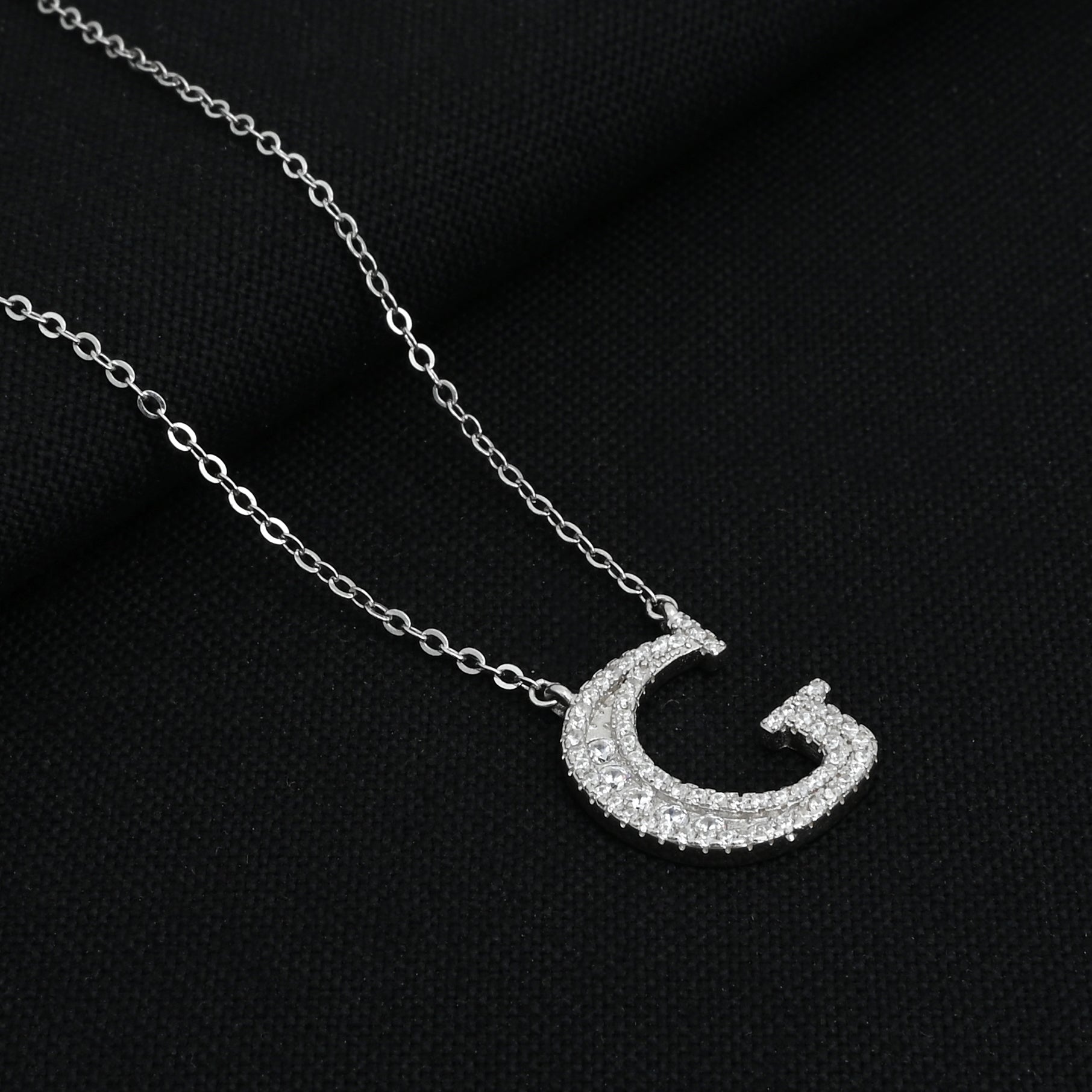 Elegant silver chain featuring a personalized 'G' pendant.