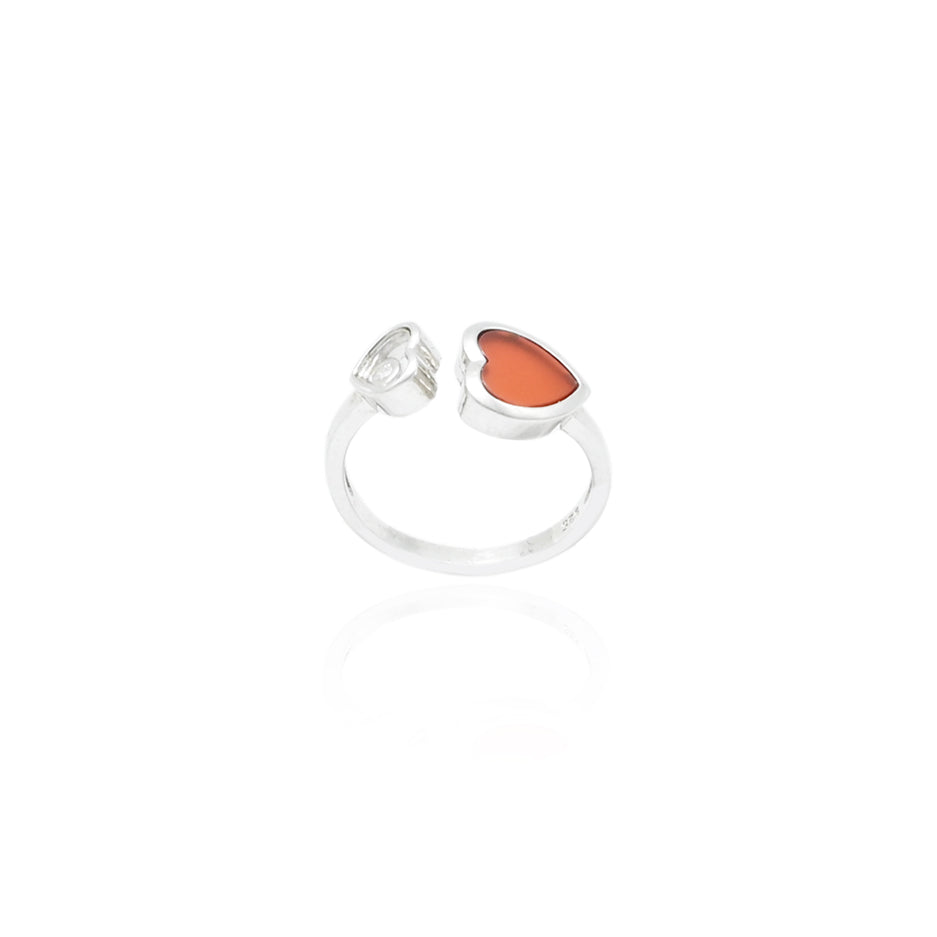 Stylish silver ring with two orange hearts symbolizing love and unity