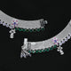 Silver bridal anklets with vibrant purple, green, and white stones