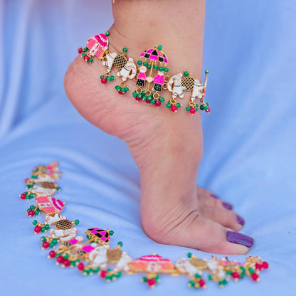 Silver payal featuring umbrella and elephant charms.