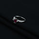 Silver ring with a radiant pink center stone, ideal for a playful and stylish look