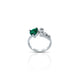 Heart-shaped emerald gemstone set in a sleek silver love ring