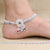 Oxidized silver anklet featuring vibrant green and pink beads.