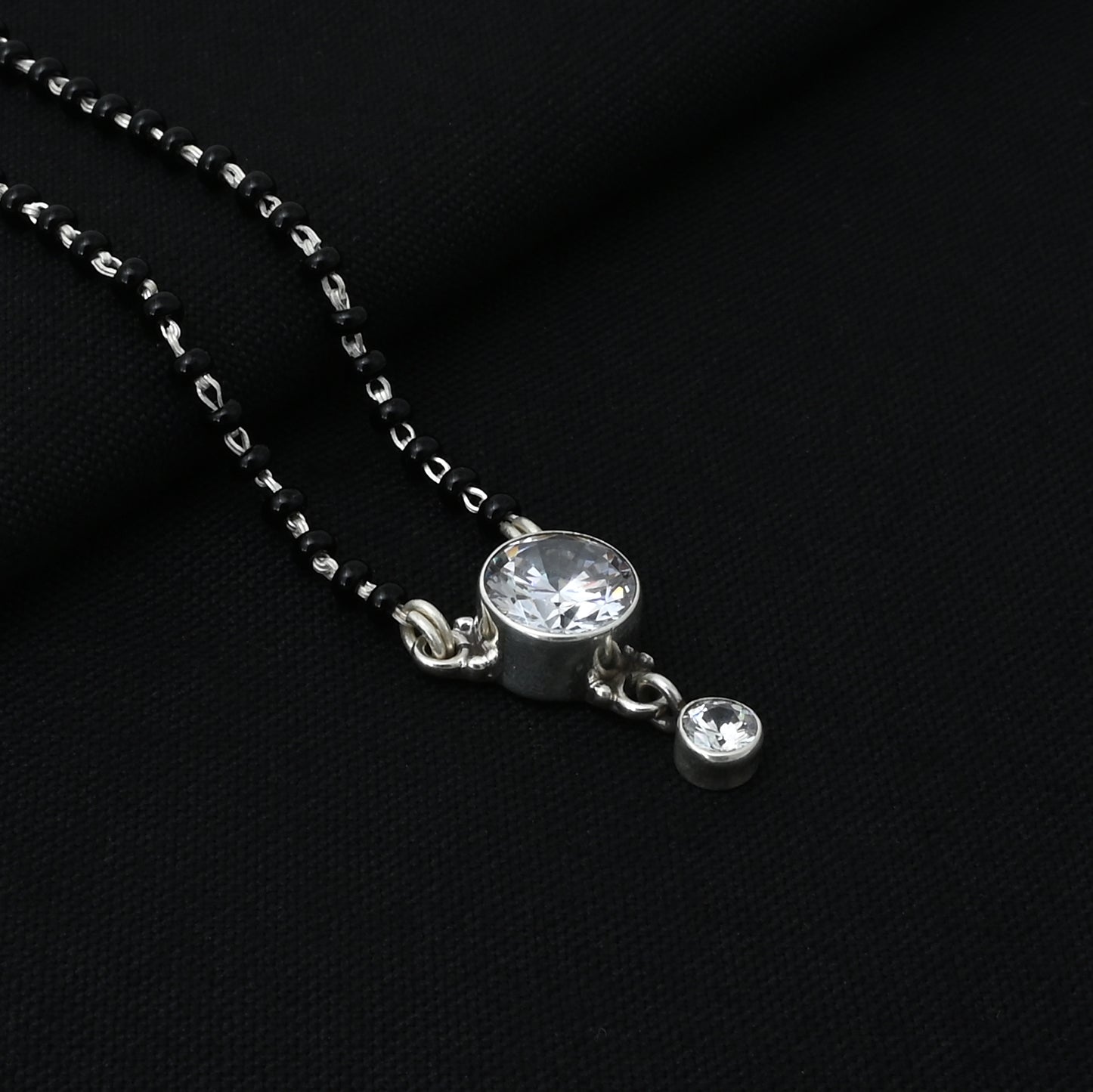 Timeless silver mangalsutra adorned with a radiant round American diamond for added elegance