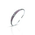 Silver kada payal with a center flower design and multiple purple stones.