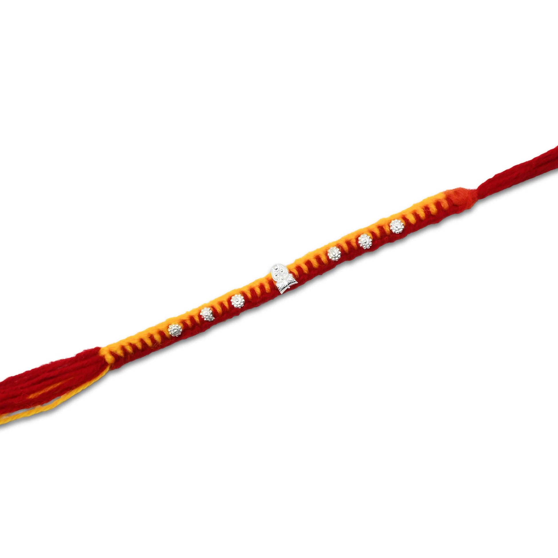 Boys' Rakhi featuring a silver Trishul centerpiece with decorative flower design beads