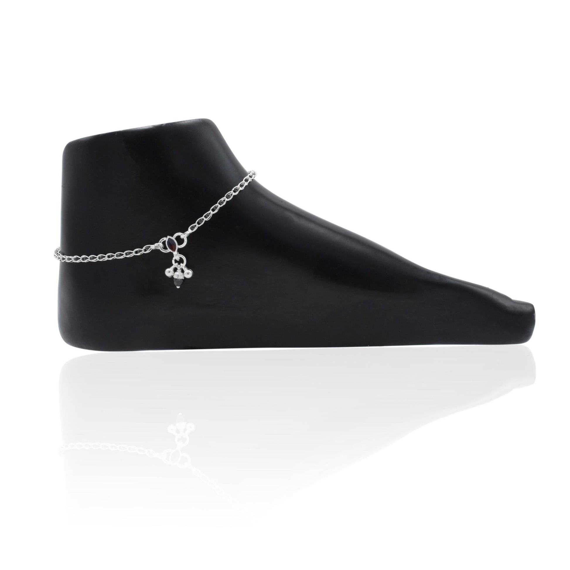 Sophisticated silver anklet featuring black beads, perfect for adding a sleek touch to any outfit