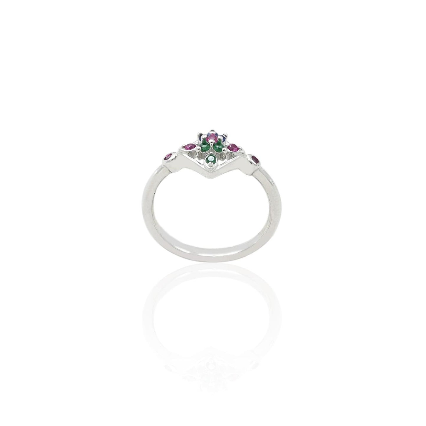 Close-up of a silver ring featuring green and pink gemstones, perfect for adding a pop of color to any outfit.