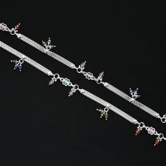 Silver payal with shiny, fancy colorful beads for a vibrant and stylish look.