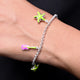 Silver bracelet with a green star and a bright pink flower for a vibrant look