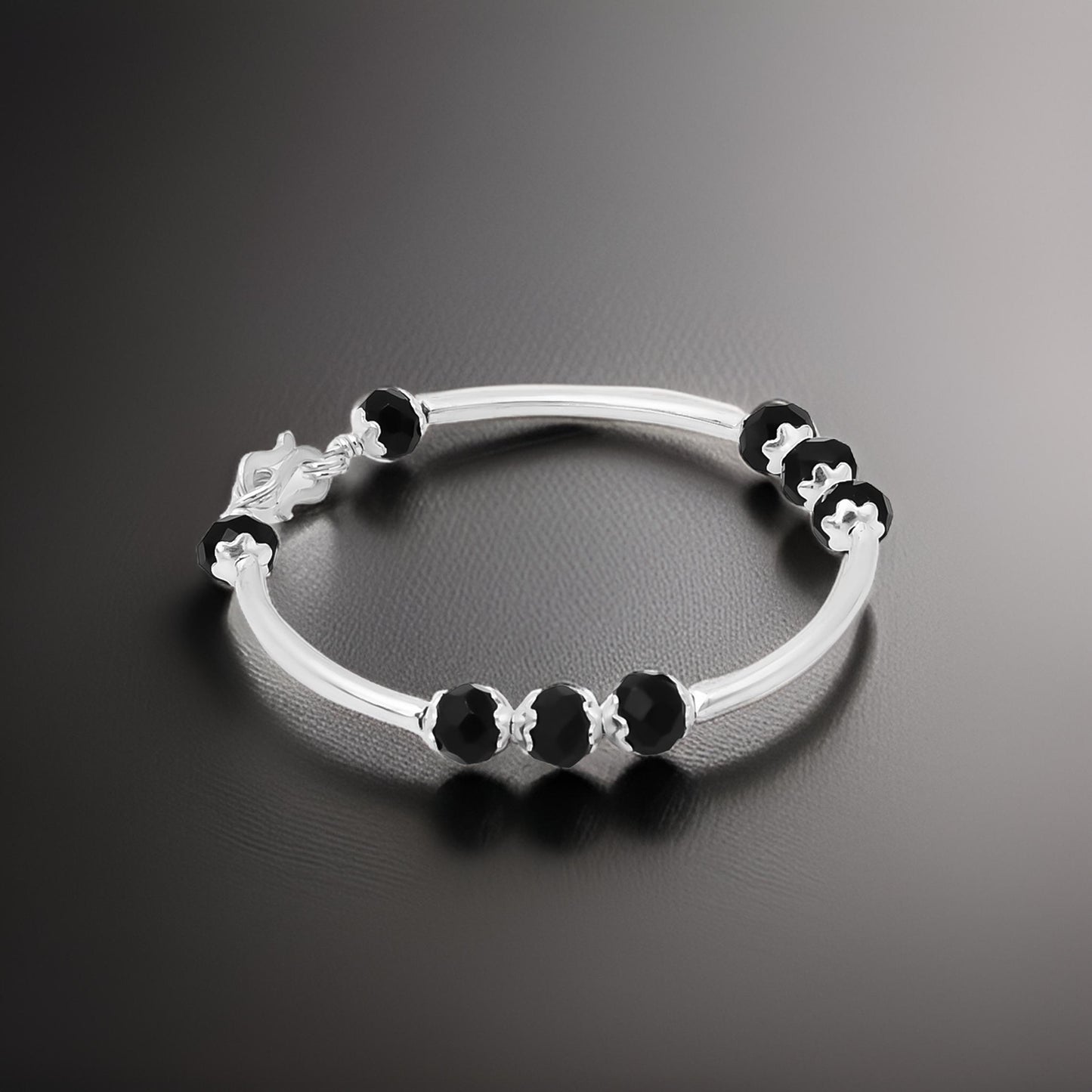 Elegant silver baby kada featuring black bead detailing