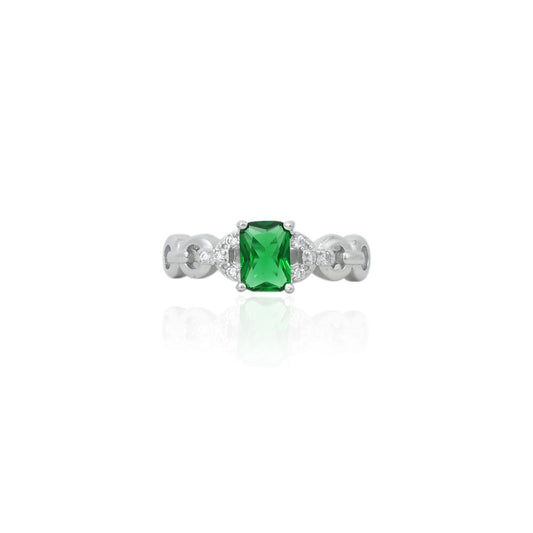 Silver ring featuring a stunning green gemstone, offering a sleek and elegant accessory for girls.