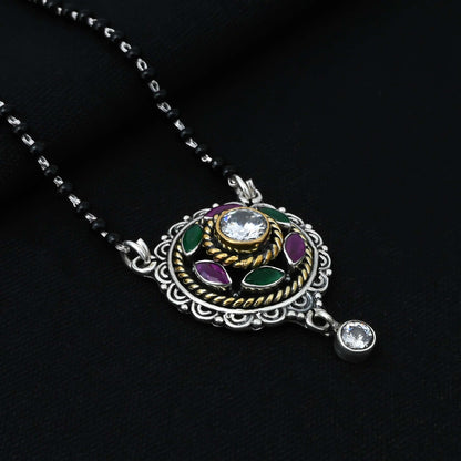 Chic sterling silver mangalsutra adorned with a maroon gem and delicate flower details