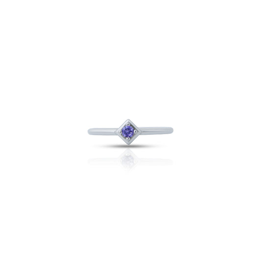 Elegant silver ring featuring a stunning round blue gemstone centerpiece.