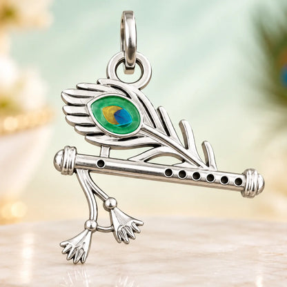 Silver Krishna flute peacock feather pendant with green blue and golden enamel detailing