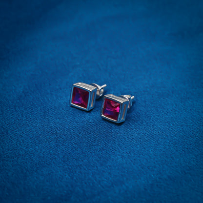 Simple silver stud earrings with square pink gemstones