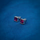 Simple silver stud earrings with square pink gemstones