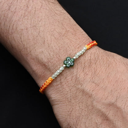 Silver Center Green Flower with Silver and Light Green Beads Rakhi for Boys