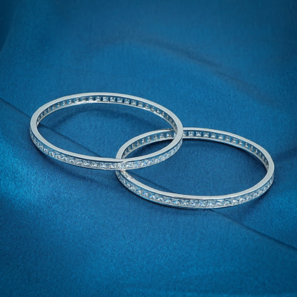 Stylish sterling silver bangles adorned with cubic zirconia stones, designed to add luxury and elegance to your look.