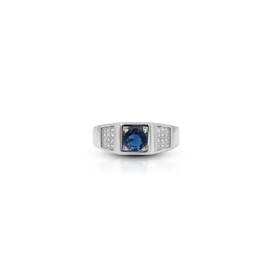 Silver ring with small round blue gemstone